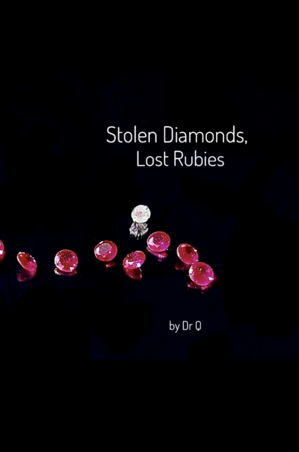 Cover: studio photograph of loose rubies in raspberry pink and a small white diamond on pure black; the title set in white above; by Dr Q lower right.